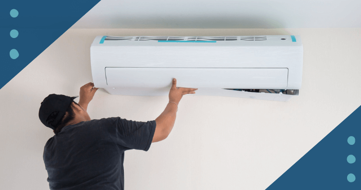 Service tech installing an AC unit