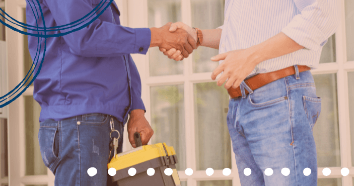 technician and customer shaking hands after selling a service