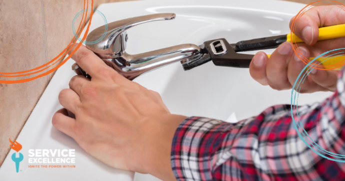 Plumber repairing sink as a side job