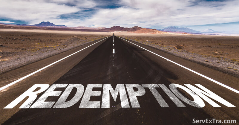 A straight road cuts through a barren landscape, "REDEMPTION" painted large in white on the asphalt—a clear new path for electricians and HVAC technicians seeking a fresh start.