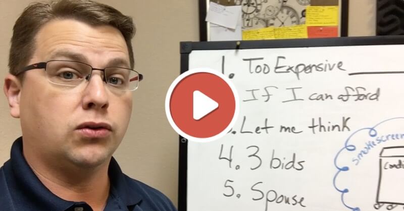 A man in glasses stands beside a whiteboard listing objections such as "Too Expensive" and "Spouse." A play button icon overlays the image, signaling service training for home service business owners.