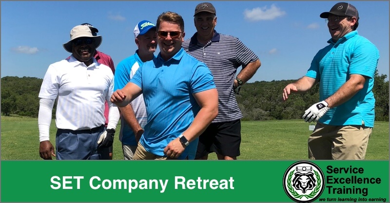 Five men stand and smile on a sunny golf course. A green banner at the bottom displays "SET Company Retreat" alongside the Service Excellence Training logo, promoting an event where home service business owners connect and learn service training.