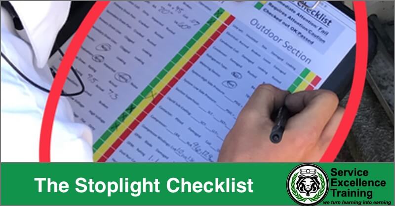 A person marks items on a printed, color-coded stoplight checklist branded with "Service Excellence Training" at the bottom—a practical tool for home services coaching or service training sessions.