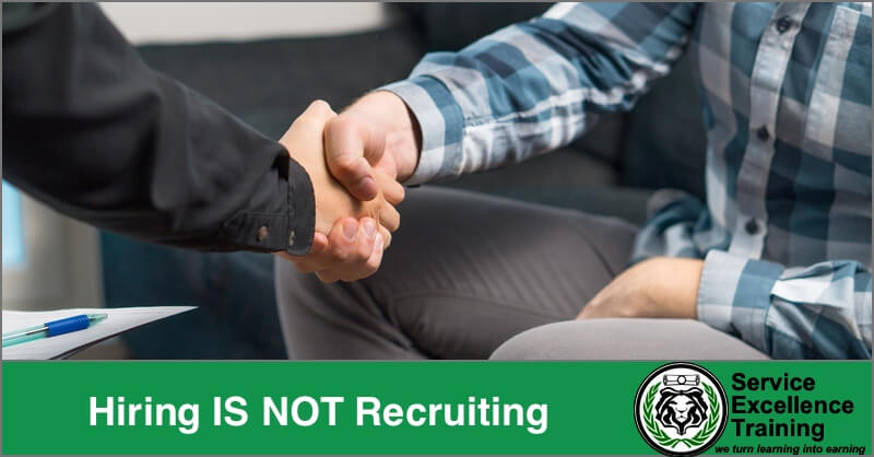 Two people shake hands in a professional setting. The text reads, "Hiring IS NOT Recruiting." The Service Excellence Training logo appears at the bottom, emphasizing coaching for home service business owners.