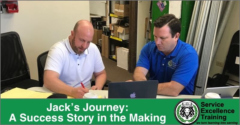 Two men work with papers and laptops at a table. The caption reads, "Jack’s Journey: A Success Story in the Making"—inspiring home service business owners through coaching, alongside the Service Excellence Training logo.