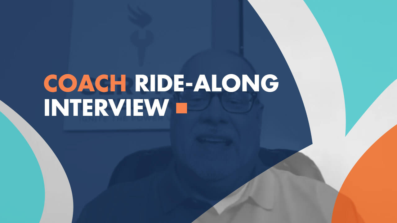 A man sits in an office; behind him, a sign hangs on the wall. Text overlay states, "Coach Ride-Along Interview." The blue, orange, and white design highlights coaching for home service business owners.