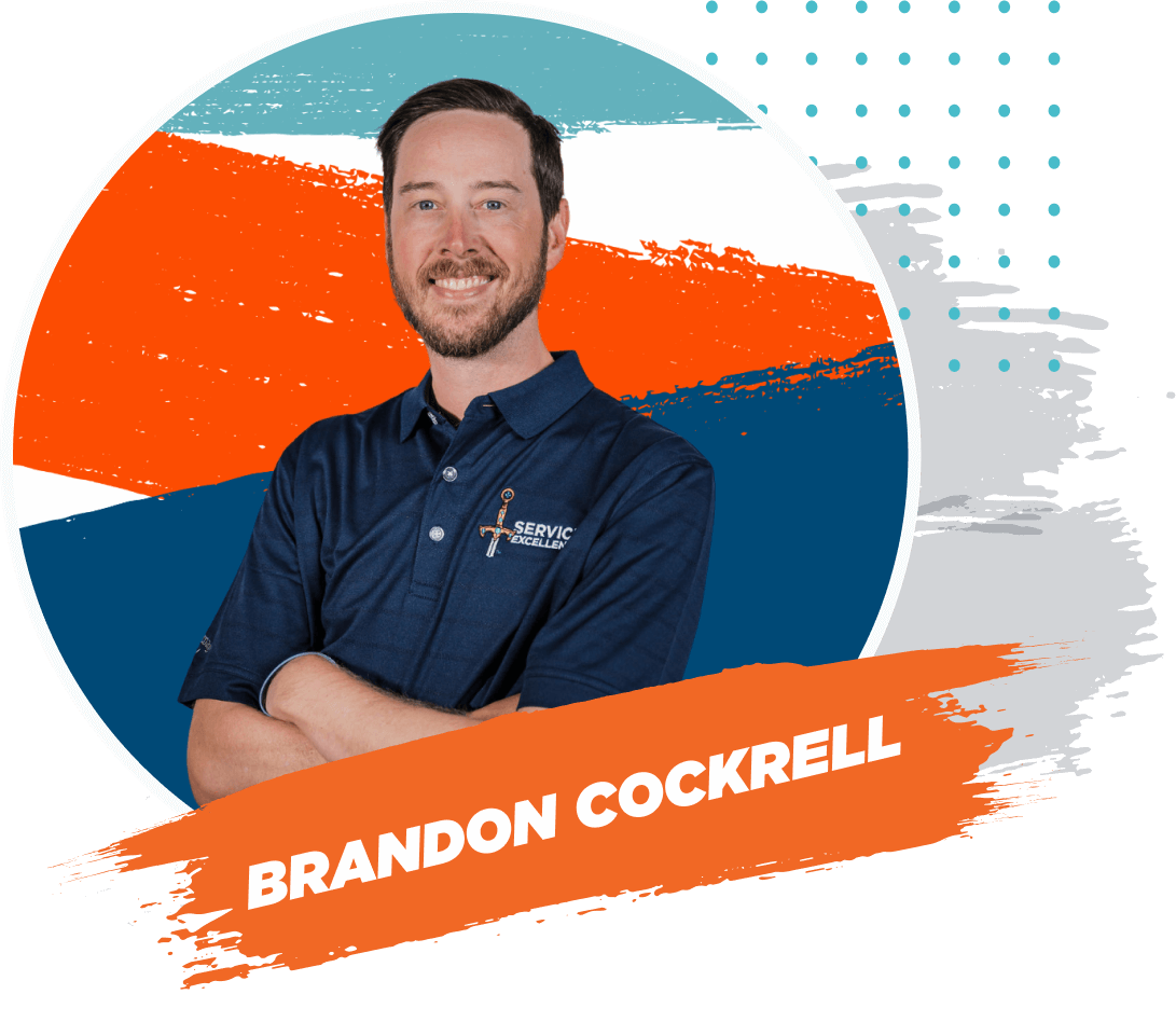 A bearded man crosses his arms and smiles, wearing a navy "Service Experts" polo shirt. He stands in front of a colorful abstract background. Brandon Cockrell leads LIVE PRESS PLAY for Tech, empowering home service business owners.