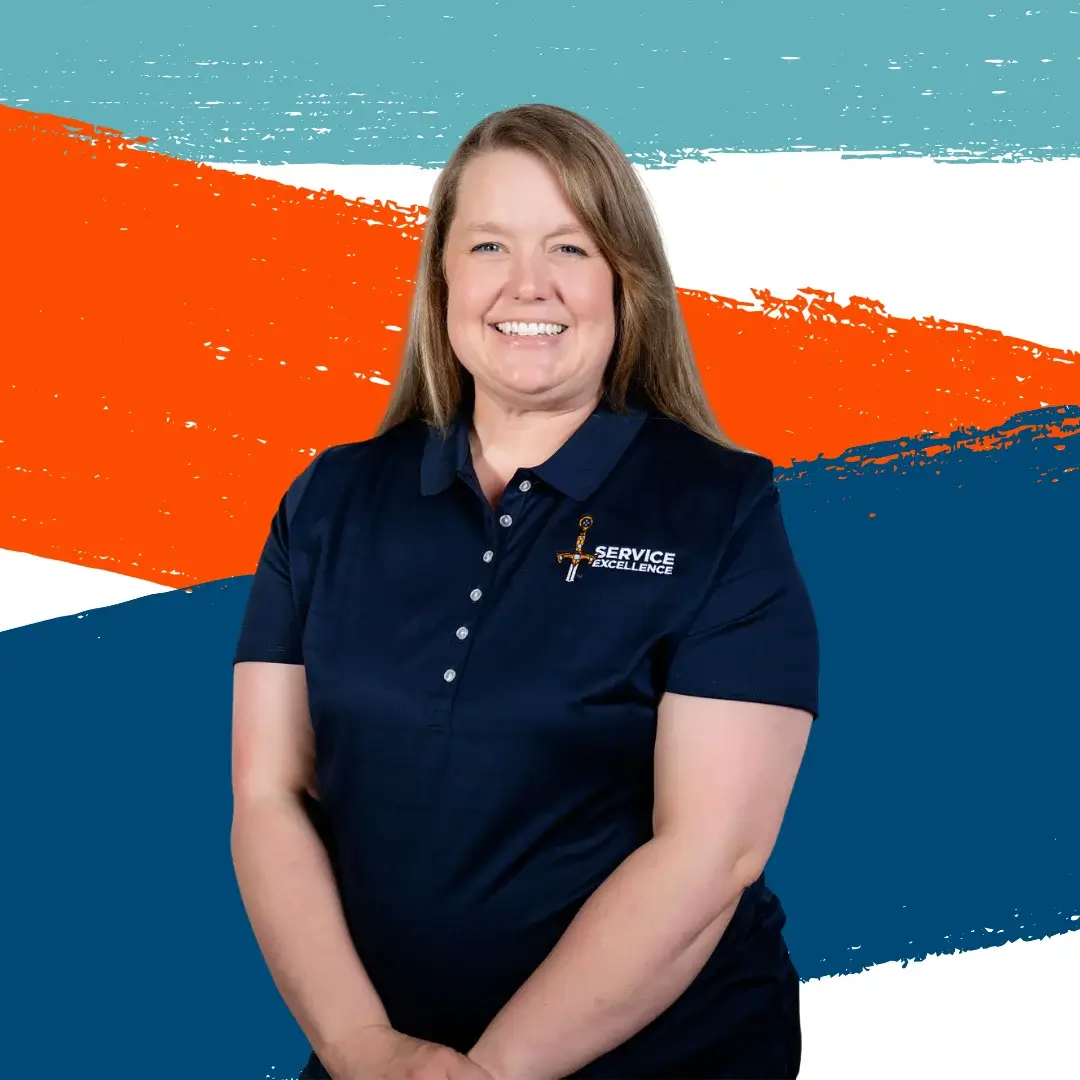 A woman wearing a navy blue polo shirt with a "Service" logo smiles in front of a colorful background, embodying Service Excellence for home service business owners. Orange, blue, and white diagonal stripes give the scene vibrant energy.
